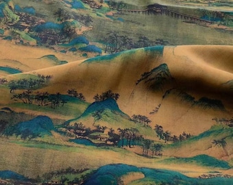 May include: A fabric featuring a printed landscape scene with rolling hills, clusters of trees, and small buildings in shades of teal, green, and brown. The material has a soft, draped texture, displaying a repeating pattern of mountains and water.