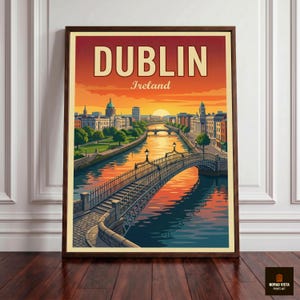 May include: Framed art print of Dublin, Ireland, featuring a sunset over the city. The image shows a bridge over a river, with buildings and trees along the banks. The word "DUBLIN" is at the top.