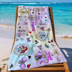 May include: A rectangular beach towel featuring a watercolor-style background with various Disney princess illustrations inside ornate oval frames, colorful bows, red apples, and the word Name printed vertically in purple script lettering.