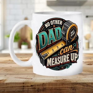 May include: A white ceramic mug featuring a circular graphic with a yellow tape measure and the text NO OTHER DAD can MEASURE UP. The design includes teal, orange, and black accents, with the phrase BUILT TO LAST printed on the tape measure.