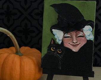 Peinture d’une sorcière d’Halloween avec chat noir - Petite toile avec chevalet en bois - Décoration intérieure - Décor d’Halloween - Idée cadeau - Peinture originale