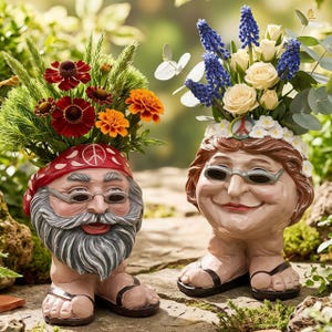 May include: Two whimsical garden planters shaped like smiling faces, one male and one female, each with a head full of colorful flowers. The male planter wears a red bandana with a peace sign, while the female has a floral crown. Both wear sunglasses and sandals.