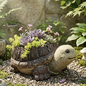 May include: A detailed turtle-shaped planter, crafted from textured brown material, filled with a variety of succulents in shades of green and purple. The turtle's head is a light beige color, and the planter is set on a bed of small pebbles.