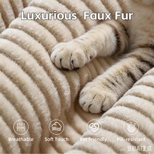 May include: Close-up of a cream-coloured faux fur pet bed with a ribbed design. A cat's paws are visible on the bed. The image includes text: "Luxurious Faux Fur", "Breathable", "Soft Touch", "Pet Friendly", and "Pill-resistant".