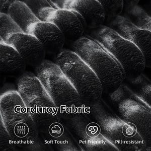 May include: Close-up of black corduroy fabric. The image shows the texture and pattern of the fabric, with the words "Corduroy Fabric" and icons indicating breathability, soft touch, pet-friendliness, and pill-resistance.