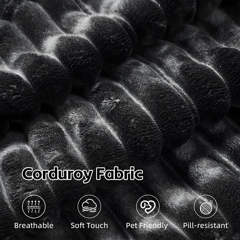 May include: Close-up of black corduroy fabric. The image shows the texture and pattern of the fabric, with the words "Corduroy Fabric" and icons indicating breathability, soft touch, pet-friendliness, and pill-resistance.