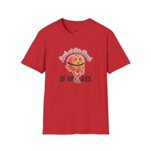 May include: Red t-shirt with a cartoon peach design and the text "Look at this Peach of an Ass". The peach is winking and wearing a garter belt. The shirt has a crew neck and short sleeves.