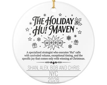 May include: A round white ceramic ornament with a gold hanging string. It features black text reading The Holiday Hu! Maven, a description of a strategist, four mahjong tiles, and the names Shan, Alex, Bob and Chris, with NYC and 2026 below.