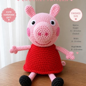 May include: A handmade pink crochet pig wearing a red dress, black feet, and pink ears. The pig's approximate height is 28-33 cm (seated), with a width of 20-23 cm. The head width is 13-14 cm. The text reads "Peppa-Style Pig Crochet Pattern."