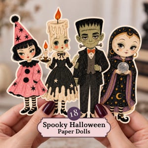 May include: Four paper dolls featuring Halloween characters: a figure in a pink star-patterned dress and hat, a candle-headed figure in a black dress, a green-skinned monster in a suit, and a figure in a star-patterned cloak holding a crystal ball.