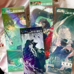 May include: Four rectangular bookmarks featuring Lord of Mysteries character illustrations. Each bookmark displays a unique anime-style scene with holographic accents, the text Lord of Mysteries, and the name Klein Moretti in English and Chinese characters.