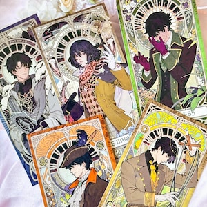 May include: A collection of five rectangular art prints featuring stylized illustrations of characters in ornate, decorative frames. Each print displays intricate patterns, vibrant colors, and text elements, showcasing detailed character portraits.