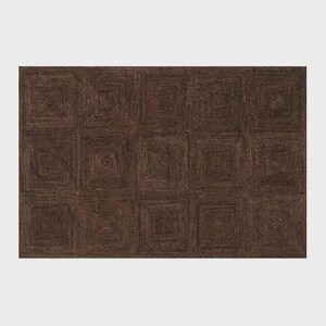 May include: A rectangular area rug featuring a dark brown, monochromatic color palette. The surface is composed of a repeating grid of square sections, each constructed with concentric, spiraling woven patterns that create a textured appearance.