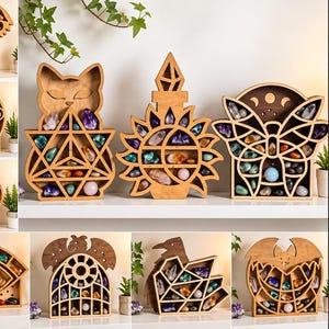 May include: A collection of ten laser-cut wooden display shelves featuring various shapes including a cat, sunflower, moth, eye, and bird, each containing multiple compartments filled with assorted colorful polished crystals and gemstones.