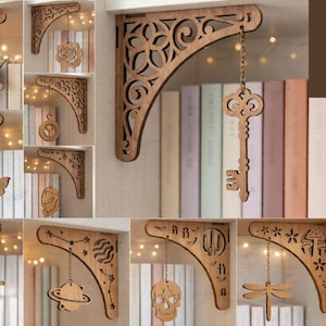 May include: A collection of laser-cut wooden shelf brackets with decorative designs, including a key, a skull, and a dragonfly. The image also displays the text "10 DESIGN" and file formats like CDR, PNG, SVG, PDF, EPS, and DFX.