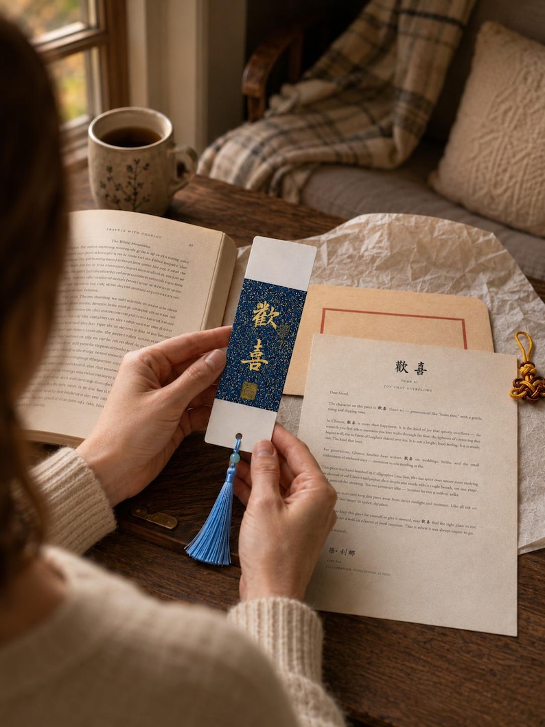 Handheld 7 by 21 cm Chinese calligraphy bookmark with white margins, colored center panel, and tassel.