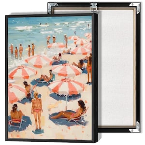 May include: A framed canvas print depicting a beach scene with people, umbrellas, and the ocean. The artwork features a vibrant color palette of blues, pinks, and whites, with a focus on leisure and relaxation. The canvas is stretched and mounted in a black frame.