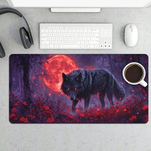 May include: A rectangular mouse pad featuring a black wolf with glowing red eyes, set against a backdrop of a red moon and a forest. The pad is covered in red flowers and foliage, creating a fantasy theme.