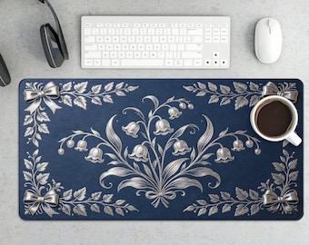 Elegante alfombrilla de escritorio para juegos con diseño floral plateado.