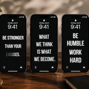 May include: Three black smartphones displaying motivational quotes in white text: "BE STRONGER THAN YOUR EXCUSES," "WHAT WE THINK IS WHAT WE BECOME," and "BE HUMBLE WORK HARD." A sandalwood candle and books are in the background.