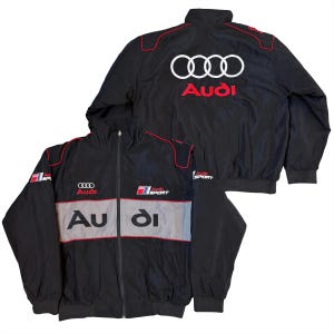 May include: Black Audi jacket with red and white accents. The jacket features the Audi logo on the front and back, along with the words "Audi Sport". The jacket has a full zipper and a stand-up collar.
