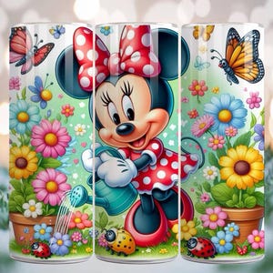 May include: A tumbler featuring Minnie Mouse in a red polka-dot dress, watering flowers in a garden scene. The design includes colorful flowers, butterflies, and ladybugs. The tumbler is cylindrical and has a glossy finish.