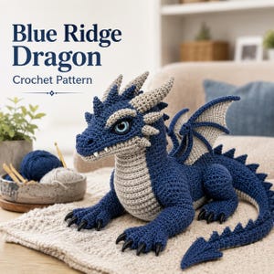 May include: A crochet dragon toy featuring dark blue and light gray yarn, with large blue eyes, pointed horns, and wings. The text Blue Ridge Dragon Crochet Pattern is displayed above the dragon, which has black claws and a long tail.