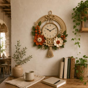 May include: A decorative wall clock with a woven rope frame and floral accents. The clock face is beige with black numerals and hands. The flowers are orange, beige, and white, with green leaves. A bow and tassel add to the design.