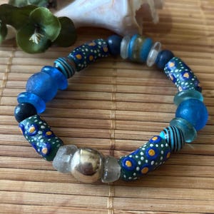 Heavenly blue trade bead bracelet with vintage sterling silver focal bead, hand painted African trade beads, and recycled glass beads