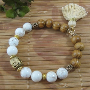 White turquoise and olive wood bracelet with brass and gold plated beads and handmade African Baule focal bead and tassel -unisex