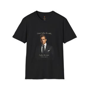 May include: Black t-shirt featuring a portrait of a man in a suit with the quote "I don't play the odds, I play the men - Harvey Specter." The shirt is made of a soft material and has a classic crew neck.