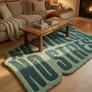 May include: A teal and light green rug with the words "NO STRESS" in large, bold letters. The rug is placed on a hardwood floor in front of a wooden coffee table. A beige sectional sofa and fireplace are in the background.