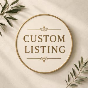 May include: A circular sign with a gold-toned metal frame and a cream-colored background. The text CUSTOM LISTING is printed in the center in a dark gold serif font, flanked by decorative gold flourishes above and below the lettering.