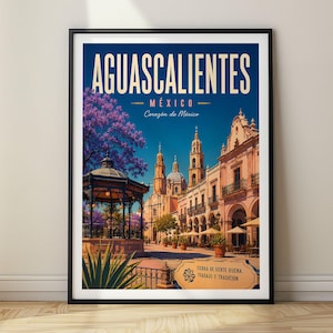 May include: A framed travel poster featuring the text AGUASCALIENTES MÉXICO Corazón de México. The illustration depicts a plaza with a gazebo, a church with towers, and purple jacaranda trees under a blue sky, with a sign reading TIERRA DE GENTE BUENA.