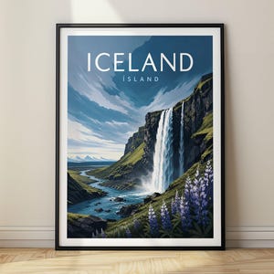 May include: A framed vertical wall art print featuring a landscape illustration of Iceland. The image displays a tall waterfall cascading down a rocky cliff into a winding river, with purple lupine flowers in the foreground and the text ICELAND ÍSLAND.