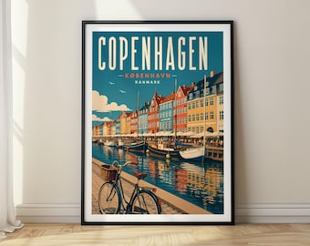 May include: A framed travel poster of Copenhagen, Denmark, featuring a canal scene with colorful buildings, docked boats, and a bicycle with a front basket in the foreground. The text reads COPENHAGEN KØBENHAVN DANMARK in a bold, sans-serif font.