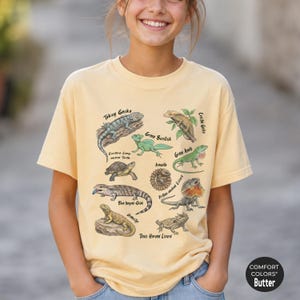 Camiseta infantil educativa con estampado de lagartos, de colores cómodos y con diseño gráfico, ideal para amantes de los reptiles.