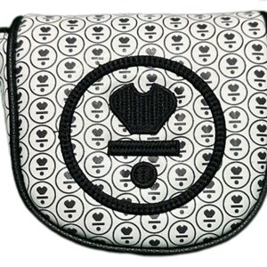May include: A white golf putter cover with a repeating pattern of black circles containing a heart and a line. The cover has a black border and a large black emblem with a crown and other shapes.