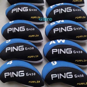 May include: A collection of black and blue golf club head covers. Each cover features the "PING G430" logo in white, with "PORFLEX" in yellow. Some covers have numbers or letters in white, indicating club type.