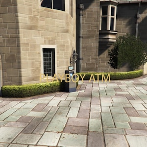 May include: Exterior shot of a building with a stone facade and a paved walkway. A sign reads "PLAYBOY ATM" in gold lettering. A small ATM machine is visible near the building's entrance. Green hedges and a small bush are also present.