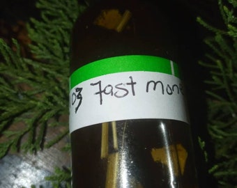 Ororo Aje' Fast money oil. Liquid money