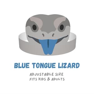 May include: A grey lizard head mask with a prominent blue tongue and a band for wearing. The text reads BLUE TONGUE LIZARD, ADJUSTABLE SIZE, FITS KIDS & ADULTS. The design features a stylised grey face with dark eyes and a bright blue tongue.