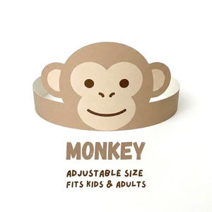 May include: A brown monkey-themed paper crown with a smiling face, large ears, and the word "MONKEY" printed below. The text "ADJUSTABLE SIZE FITS KIDS & ADULTS" is also printed below the word "MONKEY".