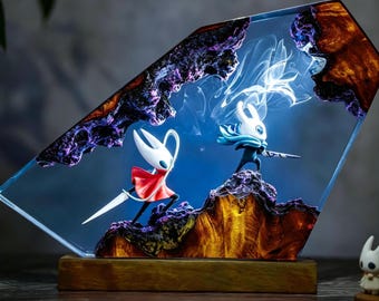 Hor.net contro il viaggio di K.night: lampade in resina, luci, statuette in seta traforata e statuette musicali, regali artigianali per l'inaugurazione della casa e oggetti da collezione per videogiocatori.