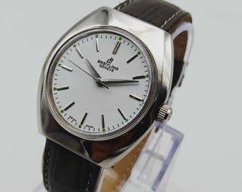Reloj BREITLING vintage: Restaurado, cuerda manual suiza, esfera blanca.