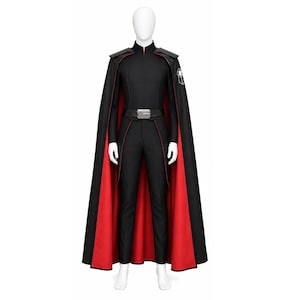 May include: Black costume with a red-lined cape. The outfit includes a high-collared jacket, matching pants, and a belt with a silver buckle. A patch with a white emblem is on the left shoulder. The cape is black on the outside and red on the inside.