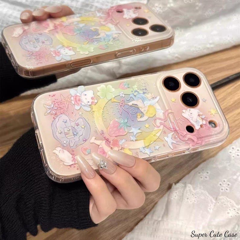 May include: Two clear phone cases with a pastel design featuring a crescent moon, stars, strawberries, and cartoon characters. The cases have a pink and gold border. The text "Super Cute Case" is visible in the bottom right corner.