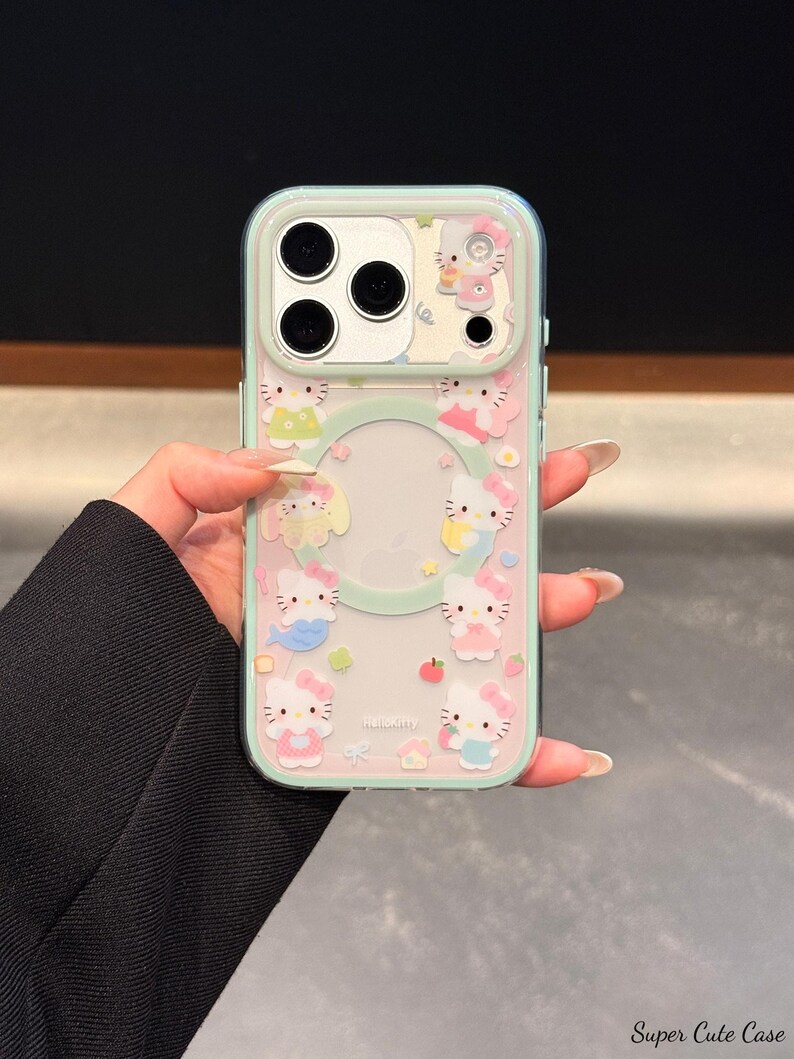 May include: Clear phone case with a mint green border and a repeating pattern of Hello Kitty characters in various outfits. The case has a clear center with a circular cutout for the phone's logo.
