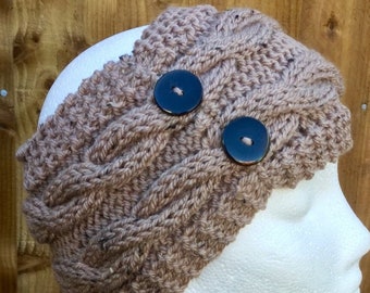 May include: A brown knitted headband with a cable knit pattern and two black buttons.