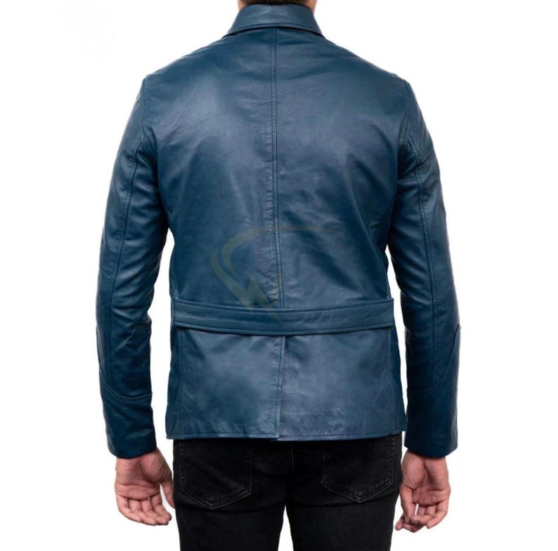 May include: A teal blue leather jacket with a notched collar and a belt at the waist. The jacket has long sleeves and a tailored fit. The back view shows the jacket's design and stitching details. The jacket is worn over black pants.